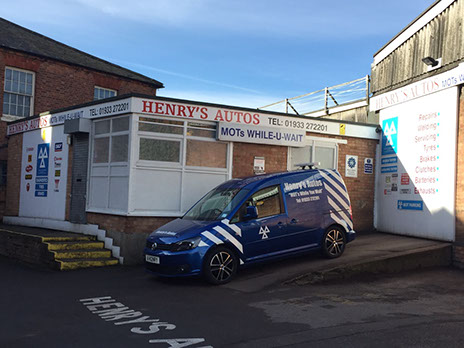 The Henry's Autos garage on Salem Lane, with the MOTs while-u-wait fascia and the garage van